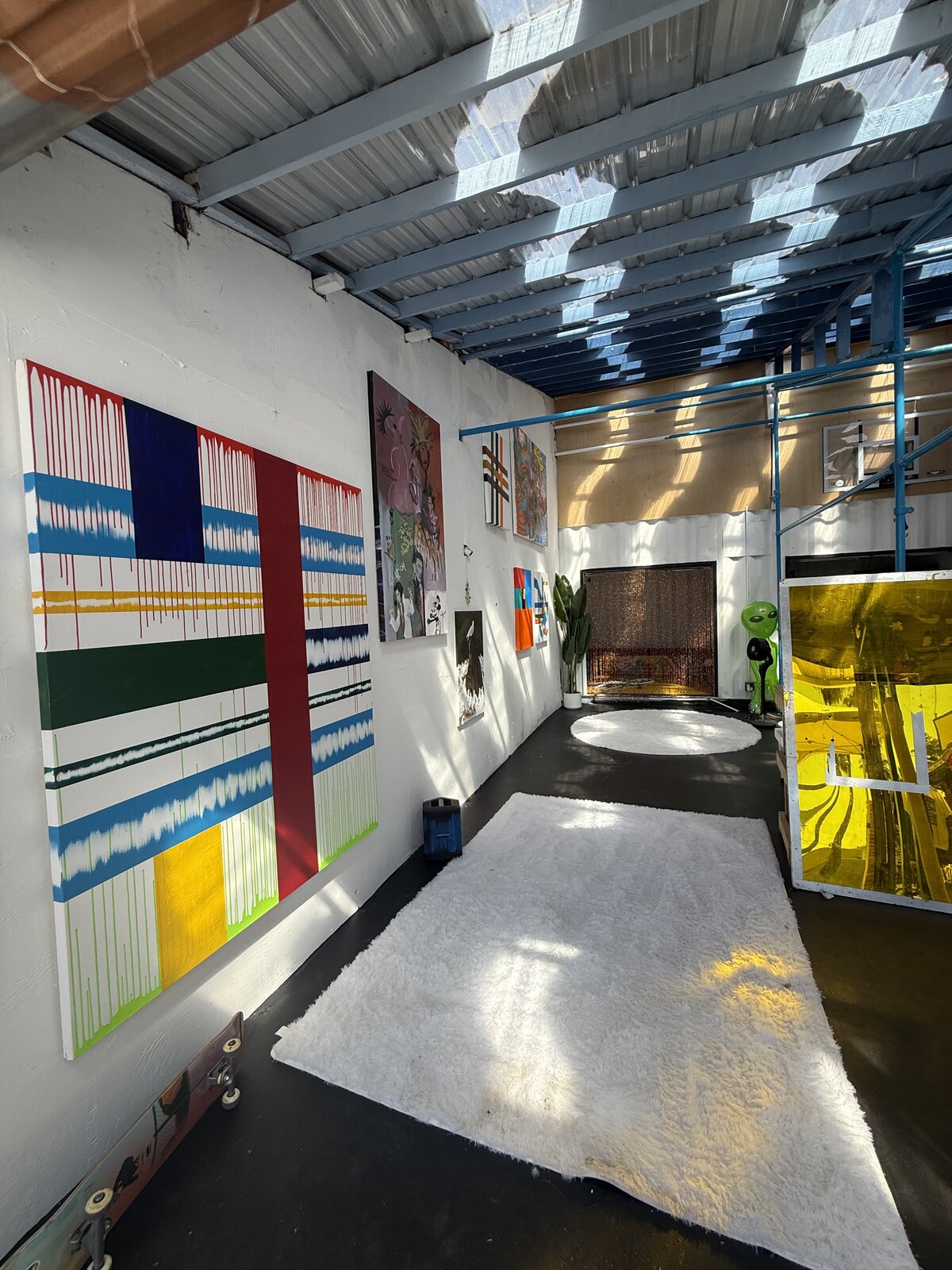 Main Gallery — The long wall under the skylit roof